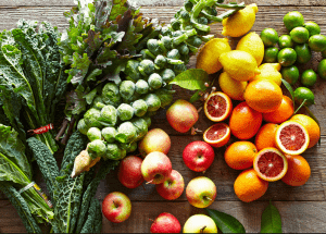a group of fruits and vegetables on a wood surface Healthy Weight Loss Diets Oxfordshire