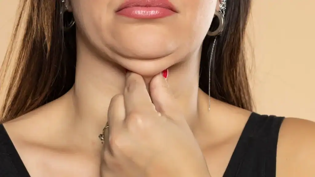 An image of a woman with double chin, sad, worried : Non Surgical Double Chin Removal Treatment in Oxfordshire, UK